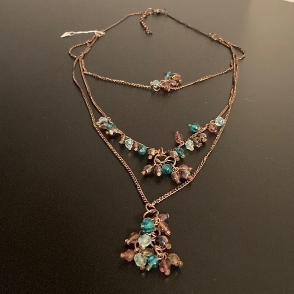 Multi-strand pink and blue long beaded necklace